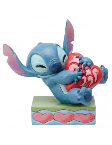 Figurine Stitch câlinant un coeur - Disney Traditions rembourrage situé sous